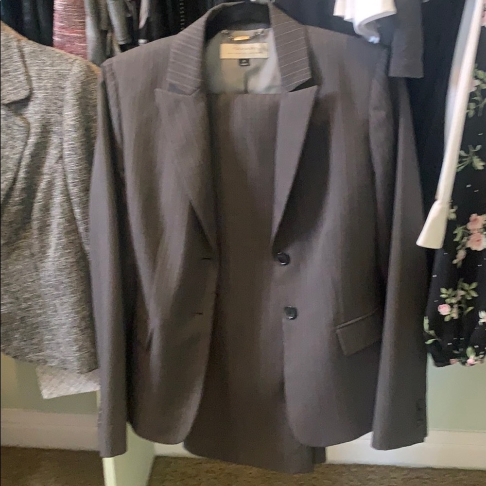 Women’s grey and white pin stripe pant suit